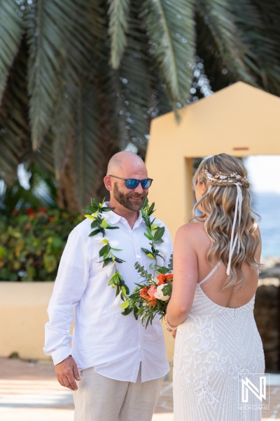 Couple exchanges vows at sunset during a stunning wedding ceremony at Avila Beach Hotel in Curacao