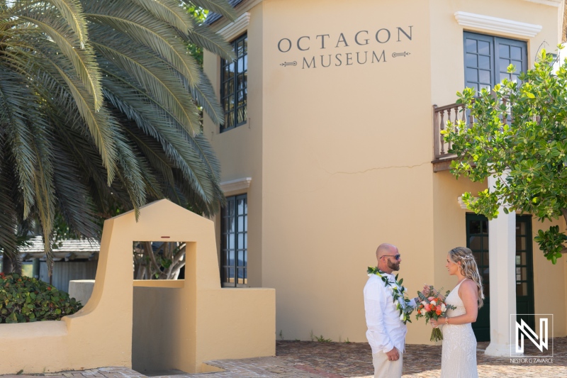 Ceremony celebration at Avila Beach Hotel during sunset in Curacao surrounded by beautiful tropical scenery and historic architecture