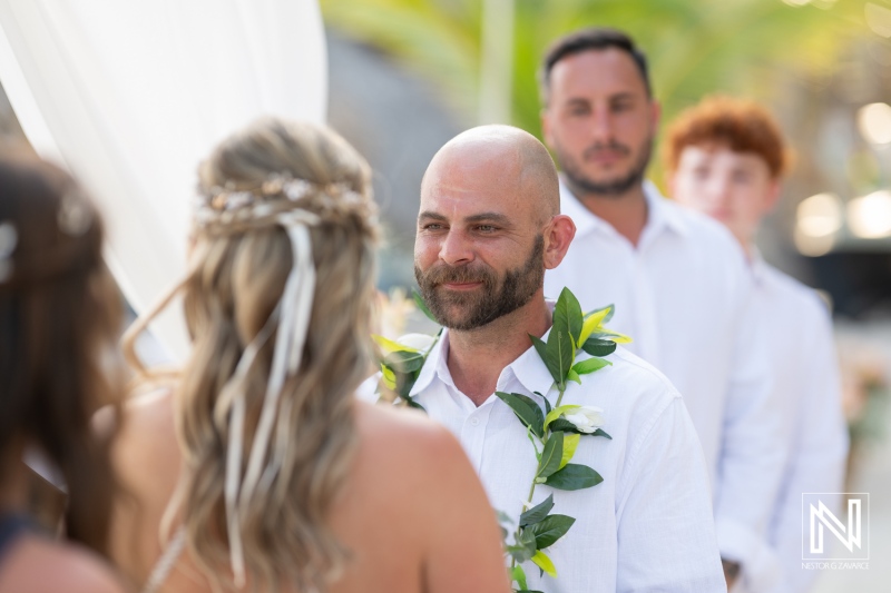 Romantic sunset wedding ceremony at Avila Beach Hotel in Curacao celebrates love and commitment