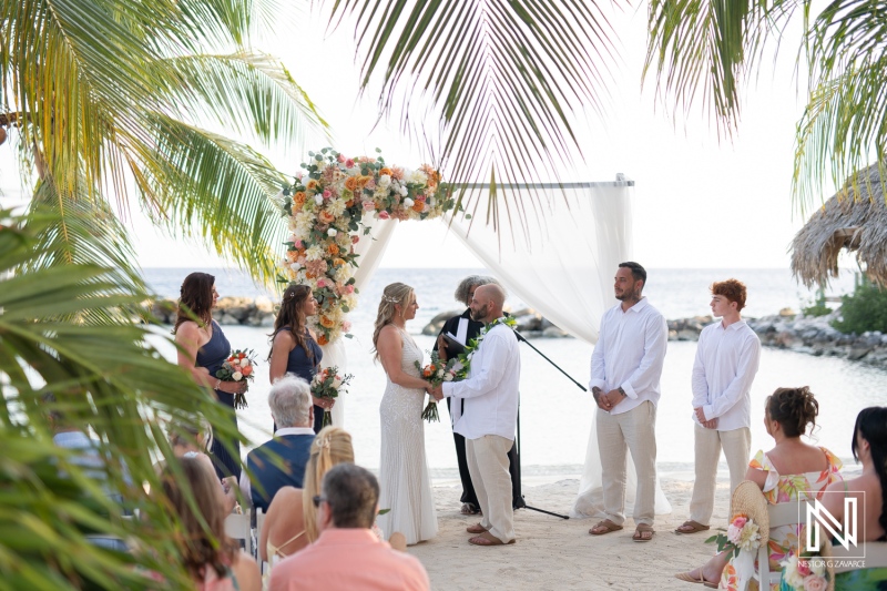 Beautiful wedding ceremony at Avila Beach Hotel in Curacao during a stunning sunset with tropical surroundings
