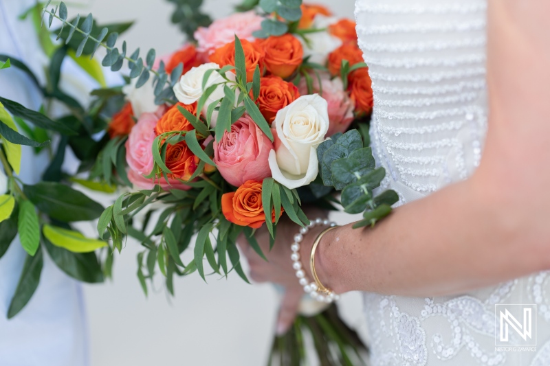 Couples celebrate love with a beautiful wedding ceremony during sunset at Avila Beach Hotel in Curacao