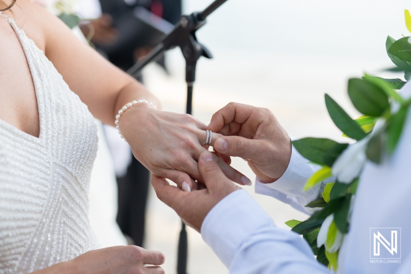 Wedding ceremony at sunset on the beach in Curacao, celebrating love at Avila Beach Hotel