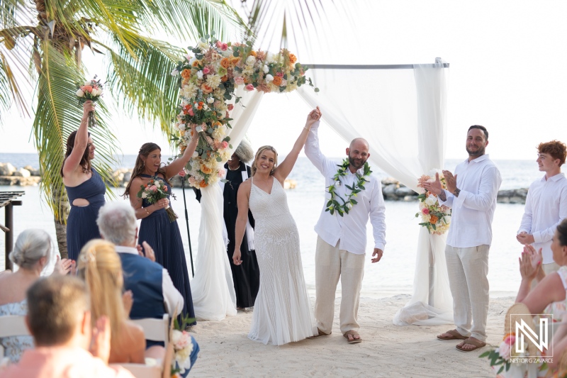 Celebrating love at sunset during a beautiful wedding ceremony at Avila Beach Hotel in Curacao