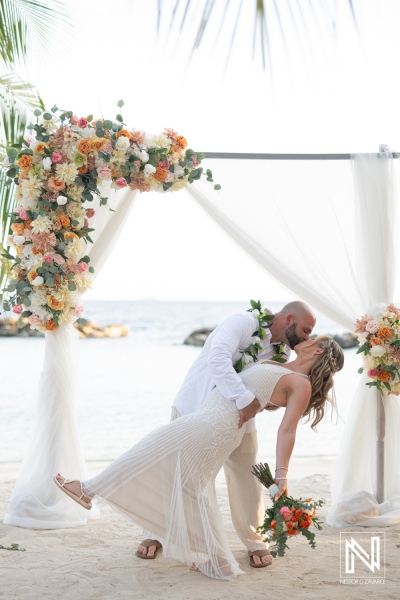Magical sunset wedding at Avila Beach Hotel in Curacao, celebrating love amidst tropical beauty and scenic ocean views