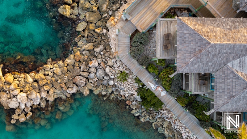 Wedding celebration at Avila Beach Hotel in Curacao against a stunning sunset backdrop, creating a magical atmosphere for couples