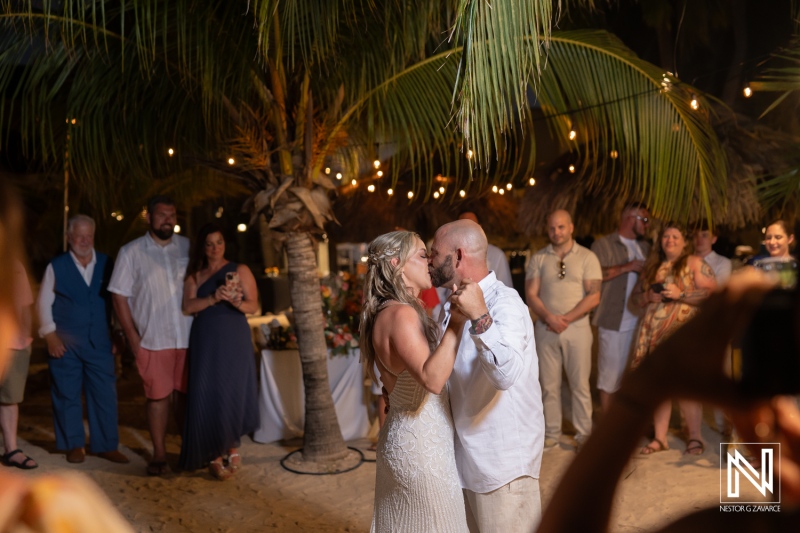 Couple shares intimate first dance during sunset wedding celebration at Avila Beach Hotel in Curacao