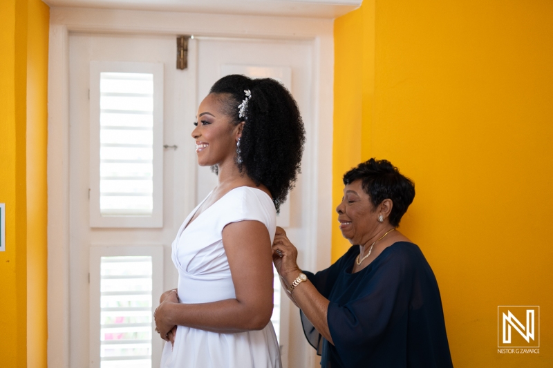 Bride getting into attire