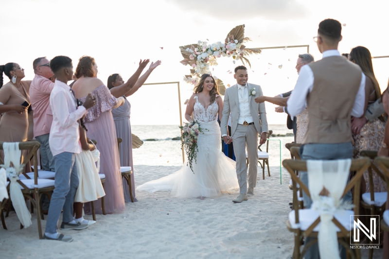 Bride and groom walking out the isle