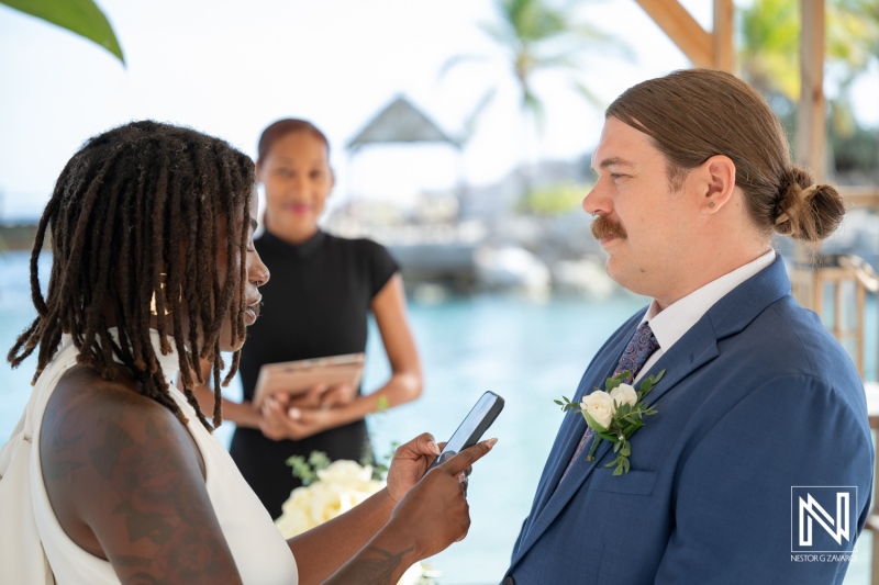 Elegant wedding ceremony at Baoase Luxury Resort in Curacao surrounded by a stunning ocean backdrop