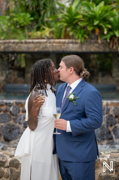Couple shares a romantic kiss during their wedding ceremony at Baoase Luxury Resort in Curacao
