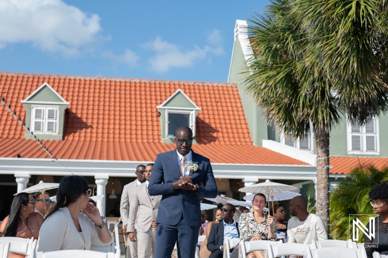 Groom walking down the aisle