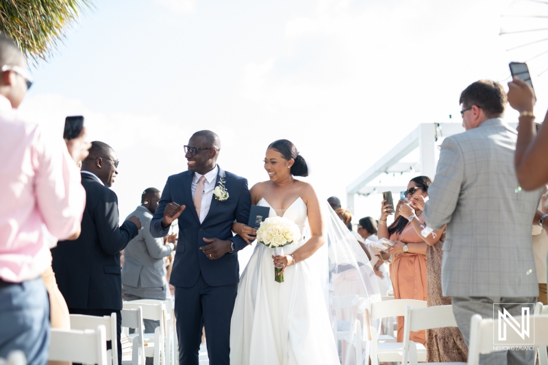 Bride and groom walking out the aisle