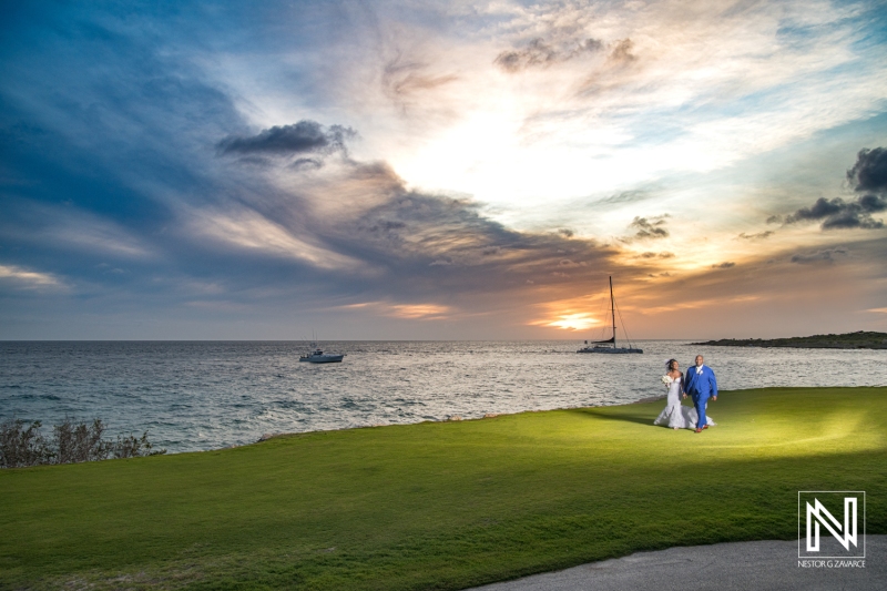 Bride and groom walking at the sunset