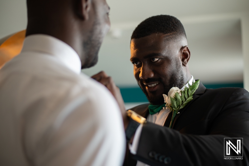 Groom getting dressed