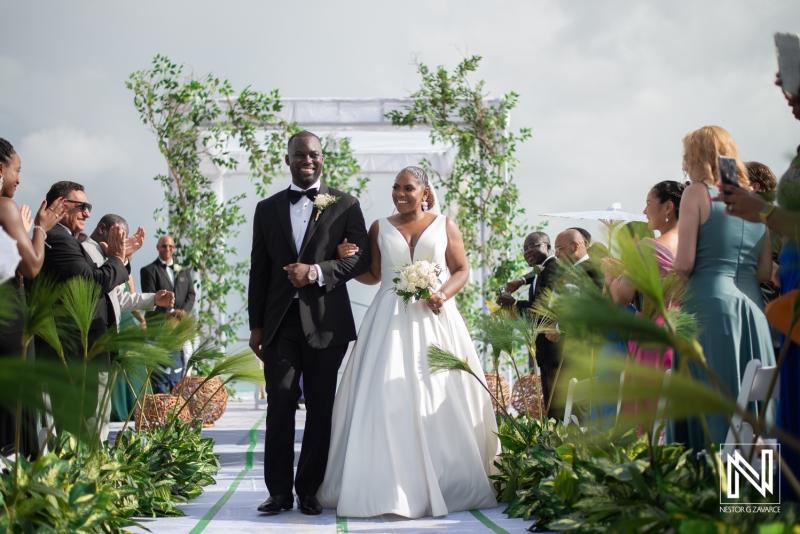Bride and groom leaving the isle