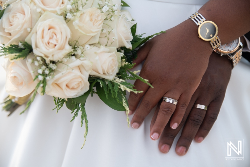 Bride and groom hands with the rings