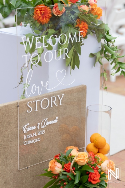 Beautiful wedding welcome sign at Avila Beach Hotel in Curacao featuring floral decorations and personal touch