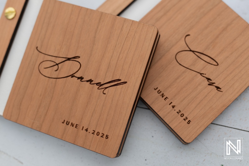 Beautiful wooden wedding invitations for a destination wedding at Avila Beach Hotel in Curacao set for June 14, 2025
