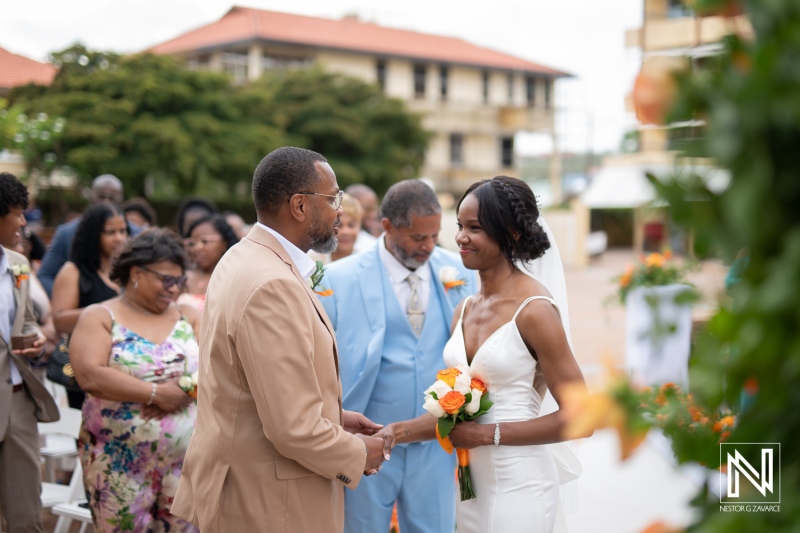 Wedding ceremony at Avila Beach Hotel in Curacao with beautiful ocean views and joyful guests celebrating love