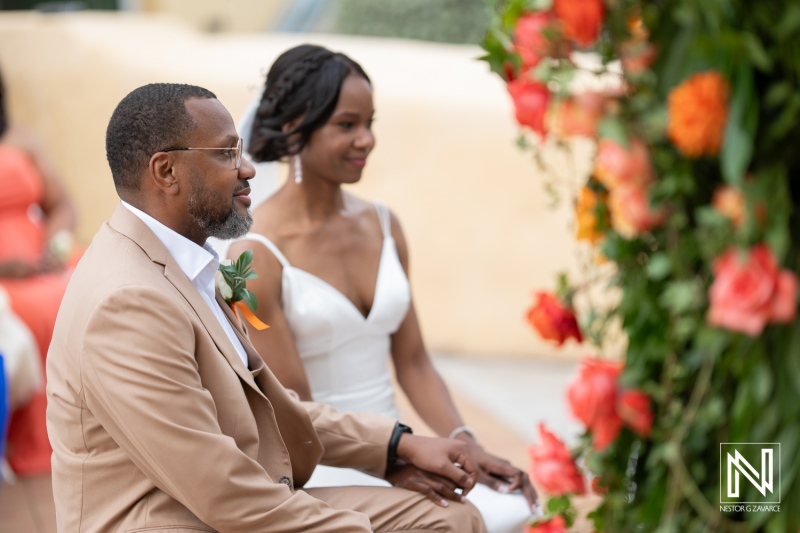 Couple exchanges vows during a joyful wedding ceremony at Avila Beach Hotel in Curacao