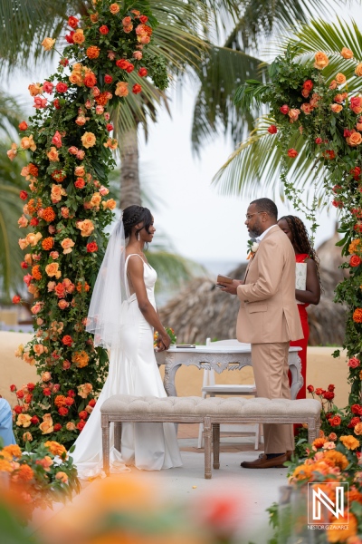 Beautiful wedding ceremony at Avila Beach Hotel Curacao surrounded by vibrant flowers and tropical scenery