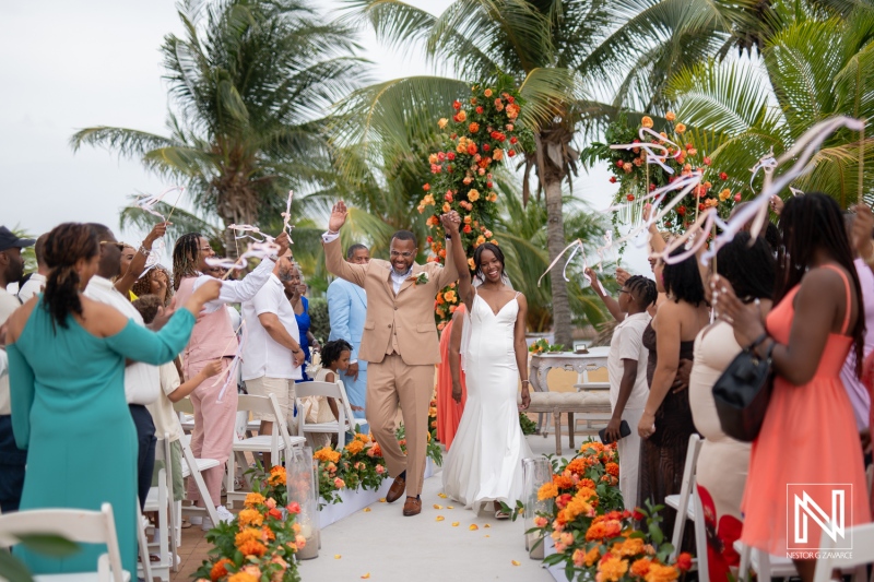 Joyful couple celebrates their union at Avila Beach Hotel in Curacao surrounded by family and friends