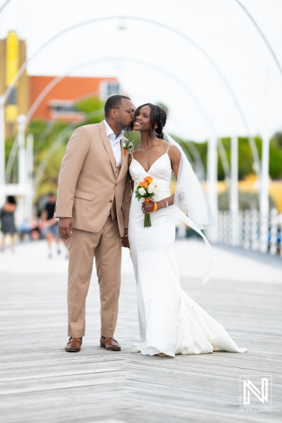 Couple shares a romantic moment during their destination wedding at Avila Beach Hotel in Curacao