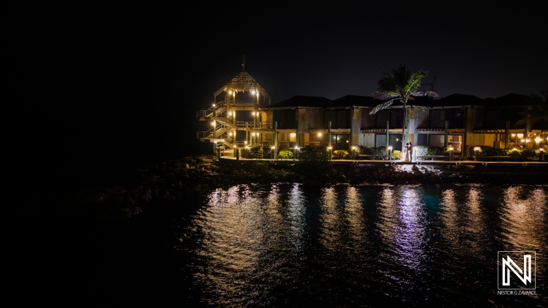 Beautiful night view of a romantic wedding at Avila Beach Hotel in Curacao surrounded by sparkling water