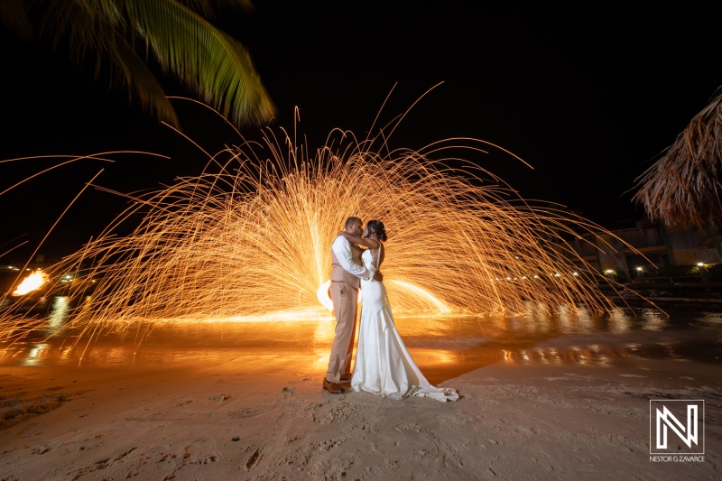 Romantic wedding ceremony at Avila Beach Hotel in Curacao with stunning firework display at night