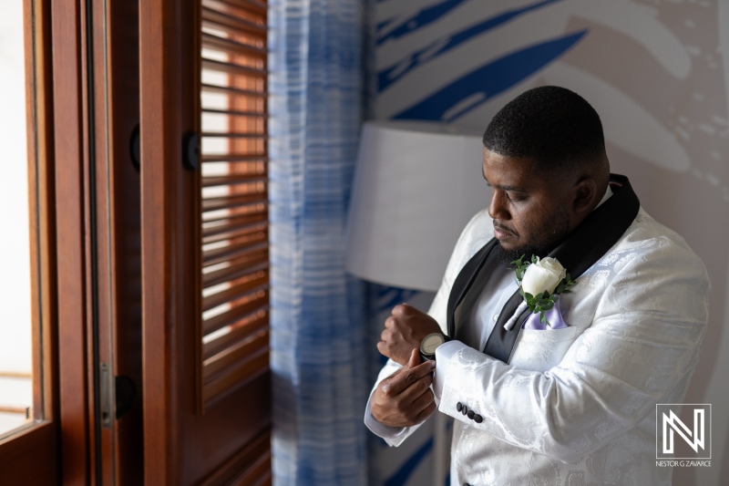 A Gentleman in a Stylish Tuxedo Adjusts His Watch While Preparing for a Formal Event in an Elegantly Decorated Room During the Afternoon