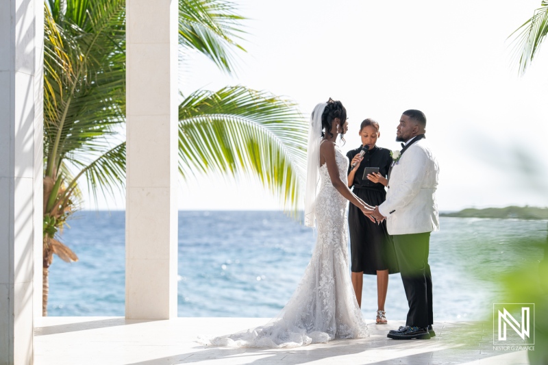 A Couple Exchanges Vows During a Tropical Beach Wedding Ceremony, With a Beautiful Ocean Backdrop and Palm Trees, Creating a Romantic Atmosphere