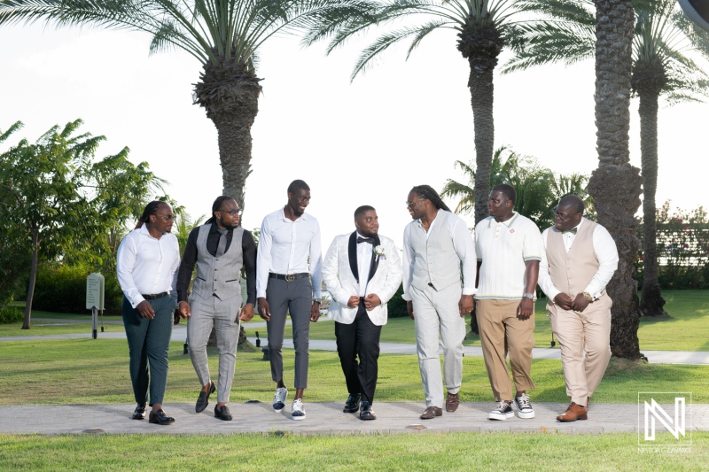 A Group of Well-Dressed Men Enjoying a Sunny Outdoor Event Among Lush Palm Trees, Showcasing Camaraderie and Celebration