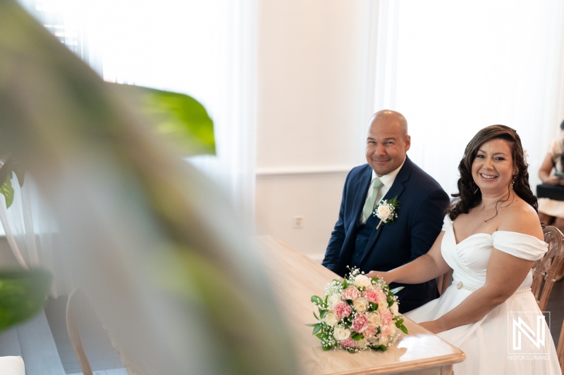Couple celebrating their wedding ceremony at a beautiful venue in Kranshi, Curacao in a serene and joyful setting