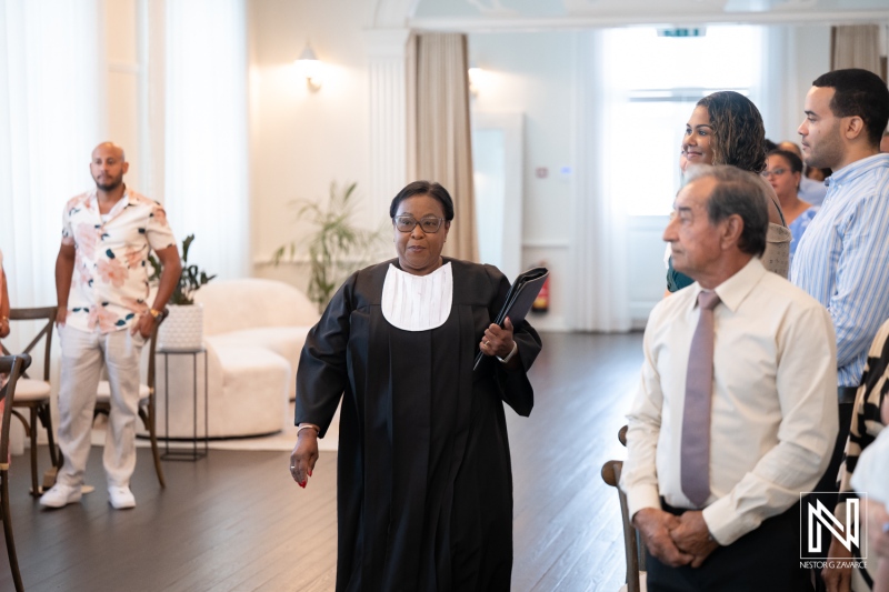 Wedding ceremony at Kranshi in Curacao with joyful guests and a celebrant preparing for the couple's special moments