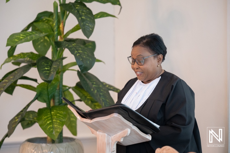 Ceremony officiant reads vows during a beautiful wedding at Kranshi in Curacao