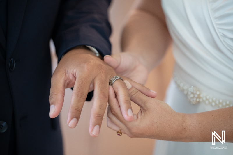 Couple exchanges wedding rings during a beautiful ceremony in Kranshi, Curacao, surrounded by love and celebration