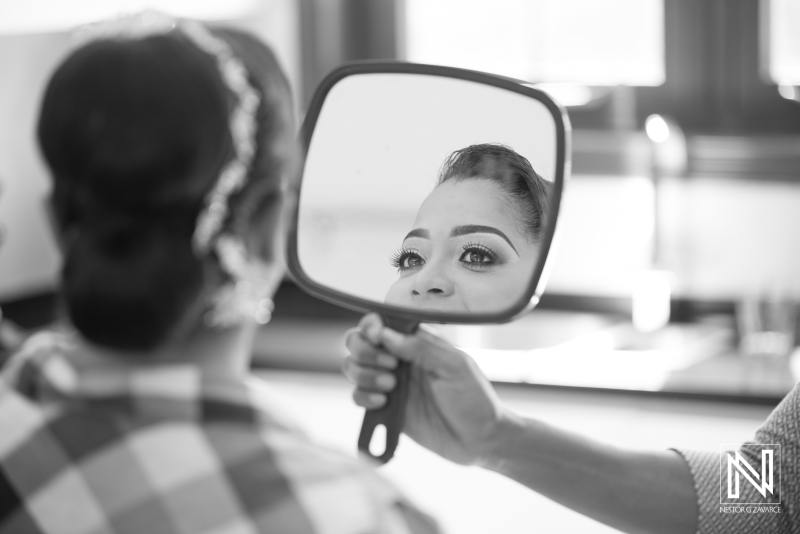 Bride looking to a mirror