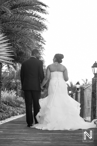 Bride and groom walking on the pier