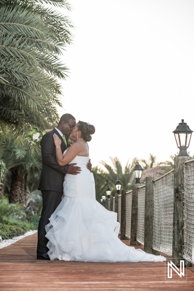 Bride and groom kisiing on the pier
