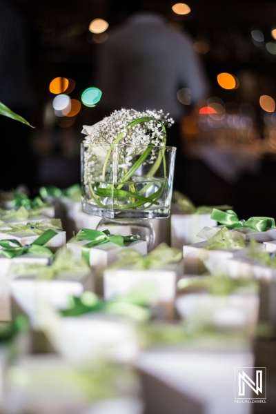 Wedding favor boxes with green ribbons