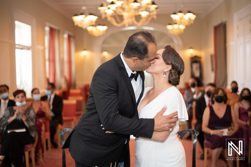 Bride and groom first kiss