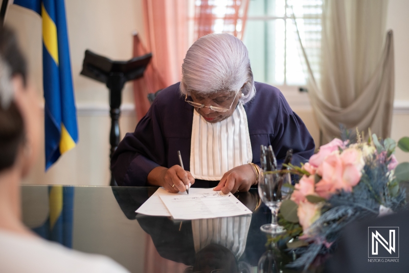 Officiant signing official wedding papers