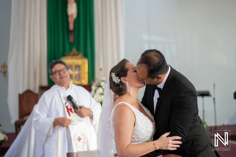 Bride and groom first kiss