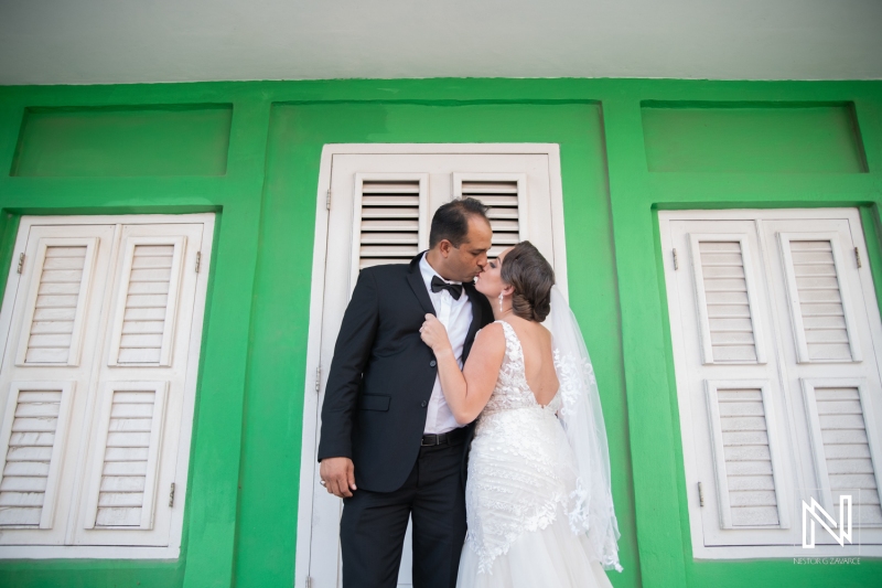 Bride and groom kiss in their photoshoot