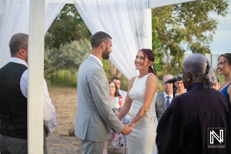 Bride and groom holding hands