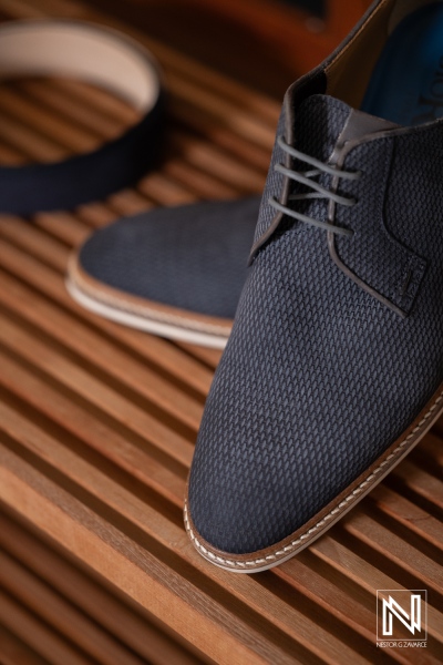 Footwear and belt on wooden surface at a wedding event in Playa Hunku, Curacao