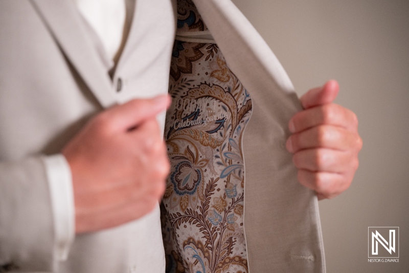 Wedding celebration at Playa Hunku in Curacao with a special suit detail shown