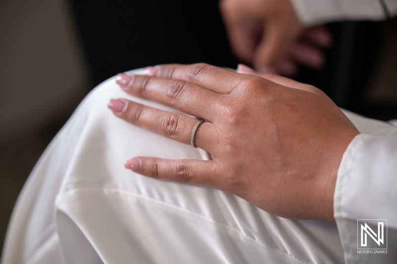 Wedding ceremony at Playa Hunku in Curacao with focus on wedding ring and bride's hand