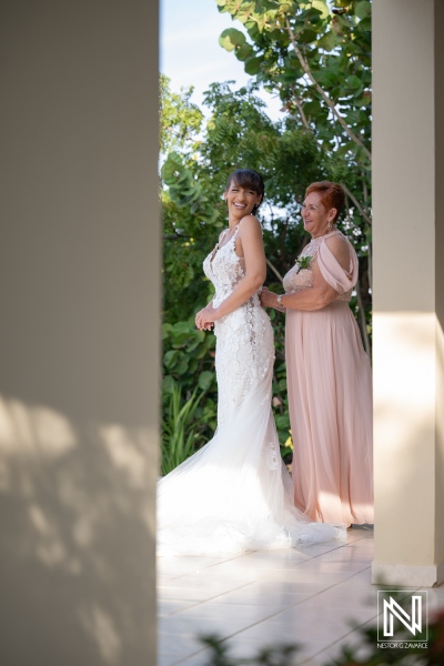 Couple prepares for wedding ceremony at Playa Hunku in Curacao with family support