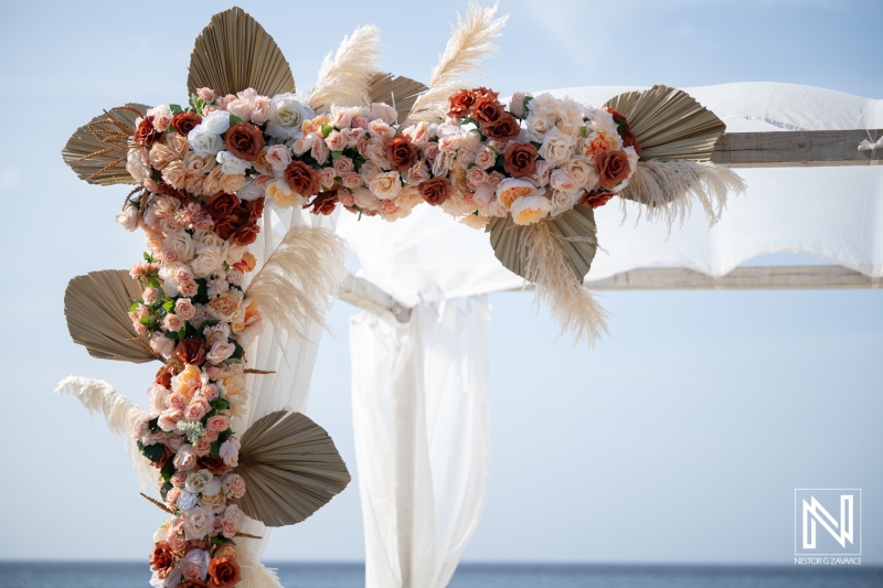 Wedding decor at Playa Hunku in Curacao with flowers and draped fabric